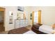 Comfortable bedroom featuring two twin beds, dresser, mirror, and a window at 1109 New Providence # 141109, Davenport, FL 33897