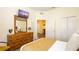 Comfortable bedroom featuring a TV, dresser and mirror, and closet space at 1109 New Providence # 141109, Davenport, FL 33897