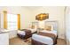 Comfortable bedroom featuring two twin beds, a window, and a bedside table at 1109 New Providence # 141109, Davenport, FL 33897
