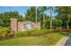 Bahama Bay Resort entrance sign, set amongst professionally landscaped grounds with mature trees at 1109 New Providence # 141109, Davenport, FL 33897