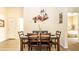Dining area offers wood table set with seating for four and modern lighting at 1109 New Providence # 141109, Davenport, FL 33897