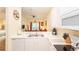 Bright kitchen offers white appliances, ample counter space, and an open view to the living room at 1109 New Providence # 141109, Davenport, FL 33897