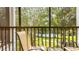 Screened-in patio featuring a table and chairs, with a view of the yard at 1109 New Providence # 141109, Davenport, FL 33897