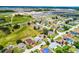 An aerial perspective highlights the suburban development, showcasing neat rows of houses and community amenities at 141 Winsor Ave, Davenport, FL 33837