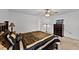 Relaxing bedroom features neutral carpeting, ceiling fan, and a closet for ample storage at 141 Winsor Ave, Davenport, FL 33837