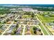 An expansive neighborhood shot illustrates the balance between residential living and commercial areas in the distance at 141 Winsor Ave, Davenport, FL 33837