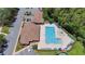 Aerial view of community pool with lane lines for lap swimming, beach entry, and lounge seating at 14244 Nottingham Way Cir, Orlando, FL 32828