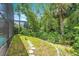 This backyard oasis is surrounded by tropical landscaping and has a nice walkway at 14244 Nottingham Way Cir, Orlando, FL 32828