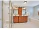 Bathroom includes a shower, garden tub, tile floors, and double sink vanity with storage at 14244 Nottingham Way Cir, Orlando, FL 32828