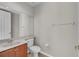 Bathroom featuring a toilet, sink and mirror at 14342 Fieldstone Lake Way, Orlando, FL 32824