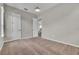 Neutral carpeted bedroom with a ceiling light, a window, and a closet with double doors at 14342 Fieldstone Lake Way, Orlando, FL 32824