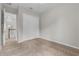 Bedroom with a double closet, light gray walls, plush carpet and a window at 14342 Fieldstone Lake Way, Orlando, FL 32824