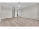 Spacious bedroom with soft carpeting and neutral paint with two doorways to other rooms at 14342 Fieldstone Lake Way, Orlando, FL 32824