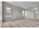 A bright bedroom showcasing soft carpeting, neutral paint, and windows providing great natural light at 14342 Fieldstone Lake Way, Orlando, FL 32824