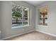 Bright bedroom with large windows overlooking the pool and backyard at 14342 Fieldstone Lake Way, Orlando, FL 32824