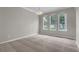 Well-lit dining area featuring a modern chandelier and scenic windows at 14342 Fieldstone Lake Way, Orlando, FL 32824
