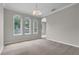 Formal dining area with chandelier lighting and lots of windows at 14342 Fieldstone Lake Way, Orlando, FL 32824