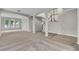 Spacious living area with open concept design and staircase at 14342 Fieldstone Lake Way, Orlando, FL 32824