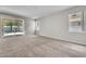 Bright living room with sliding glass doors leading to the backyard and pool area at 14342 Fieldstone Lake Way, Orlando, FL 32824