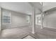 Spacious living area with neutral carpet, paint, and ample natural light at 14342 Fieldstone Lake Way, Orlando, FL 32824