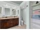 Bright bathroom featuring double sinks, built-in storage, and a toilet at 1606 Burryport Dr, Orlando, FL 32837