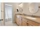 Bathroom boasting a double vanity with a beige countertop and a separate shower area at 1606 Burryport Dr, Orlando, FL 32837
