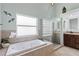 Bathroom with a soaking tub, glass-enclosed shower, and a vanity with ample counter space at 1606 Burryport Dr, Orlando, FL 32837