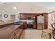 Spacious kitchen features stainless appliances, dark wood cabinetry, and eat in dining area at 1606 Burryport Dr, Orlando, FL 32837