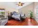 Primary bedroom featuring hardwood floors, a vaulted ceiling, and a large bed at 1606 Burryport Dr, Orlando, FL 32837