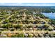 Gorgeous aerial view of a lakeside neighborhood with mature trees, well-manicured lawns and community swimming pools at 1649 Weybridge St, Deltona, FL 32725