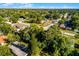 View of a home amongst a tree filled neighborhood at 1649 Weybridge St, Deltona, FL 32725