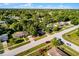 Aerial view of a residential neighborhood, showcasing well-maintained homes and lush greenery at 1649 Weybridge St, Deltona, FL 32725