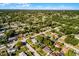 Wide aerial shot of a residential area exhibiting tidy streets, mature trees, and diverse housing at 1649 Weybridge St, Deltona, FL 32725