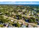 An elevated view of a tree-filled suburban neighborhood, portraying an organized and green living space at 1649 Weybridge St, Deltona, FL 32725