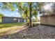 View of the backyard featuring a mature tree and shed at 1649 Weybridge St, Deltona, FL 32725