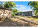 Spacious backyard with a storage shed and the rear of the house at 1649 Weybridge St, Deltona, FL 32725