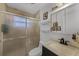 Updated bathroom featuring a glass shower, modern toilet, and updated sink at 1649 Weybridge St, Deltona, FL 32725