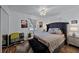 This main bedroom features a large bed, neutral walls, and hardwood floors at 1649 Weybridge St, Deltona, FL 32725