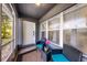 Cozy screened porch with seating, tile floors, and plenty of natural light at 1649 Weybridge St, Deltona, FL 32725