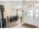 Open foyer area with sight lines to the dining room, and light and bright walls, with view to front yard at 165 Fig Tree Run, Longwood, FL 32750
