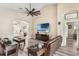 Spacious living room boasts wood floors, vaulted ceilings, and an entertainment center at 165 Fig Tree Run, Longwood, FL 32750