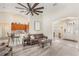 Open floorplan living room with hardwood floors and views of kitchen and entry at 165 Fig Tree Run, Longwood, FL 32750