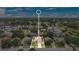 Aerial view of a home in a residential neighborhood with mature trees and well-maintained lawns at 1916 Excalibur Dr, Orlando, FL 32822