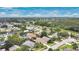 An aerial view shows a residential area with green trees and well kept lawns at 1916 Excalibur Dr, Orlando, FL 32822