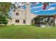 This yard features a covered, screened in patio, and lush grass at 1916 Excalibur Dr, Orlando, FL 32822
