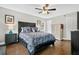 Cozy bedroom featuring a dark wood bed frame with matching furniture and hardwood flooring at 1916 Excalibur Dr, Orlando, FL 32822