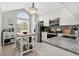 Bright kitchen features white cabinets, granite countertops, stainless steel appliances and a breakfast nook at 1916 Excalibur Dr, Orlando, FL 32822