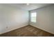 Bright bedroom features neutral carpet and a window, offering a cozy and inviting space at 228 Aquamarine Ln, Kissimmee, FL 34758