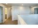 Upper hallway showing white trim and neutral carpet leading to bedrooms and bathrooms at 228 Aquamarine Ln, Kissimmee, FL 34758