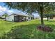 Spacious backyard with a screened patio, ideal for outdoor activities and relaxation at 2718 Limerick Cir, Grand Island, FL 32735